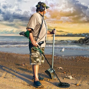 Man on beach metal detecting with the teknetics t2+